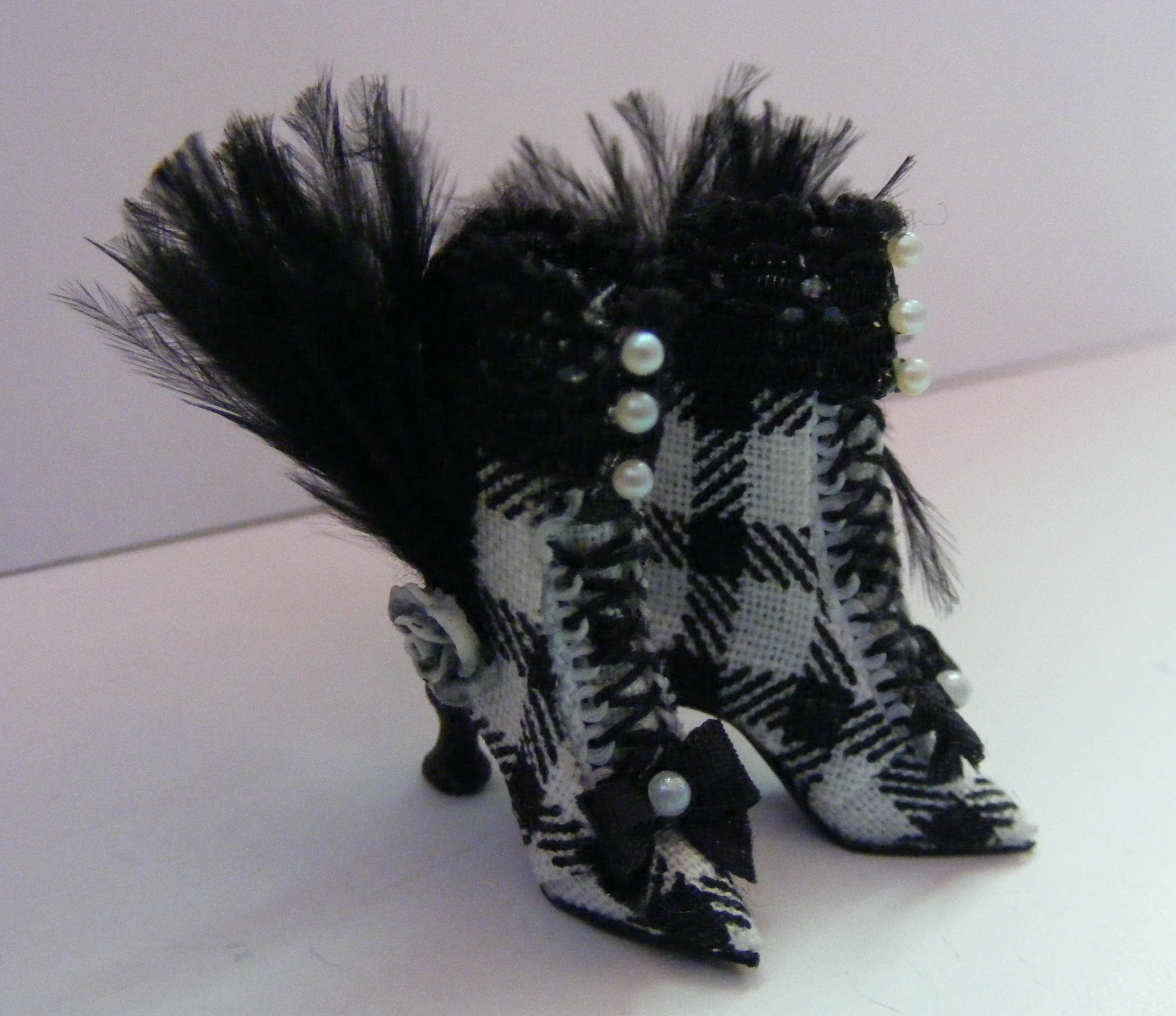 BLACK & WHITE CHECK BOOTS WITH FEATHERS