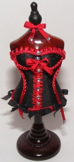 BLACK & RED CORSETT ON STAND BLACK & RED CORSETT ON STAND